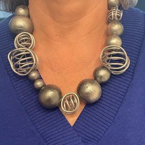 Flashy, Overstated necklace.